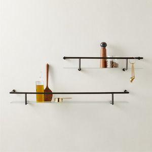 glass floating shelves with spices on it